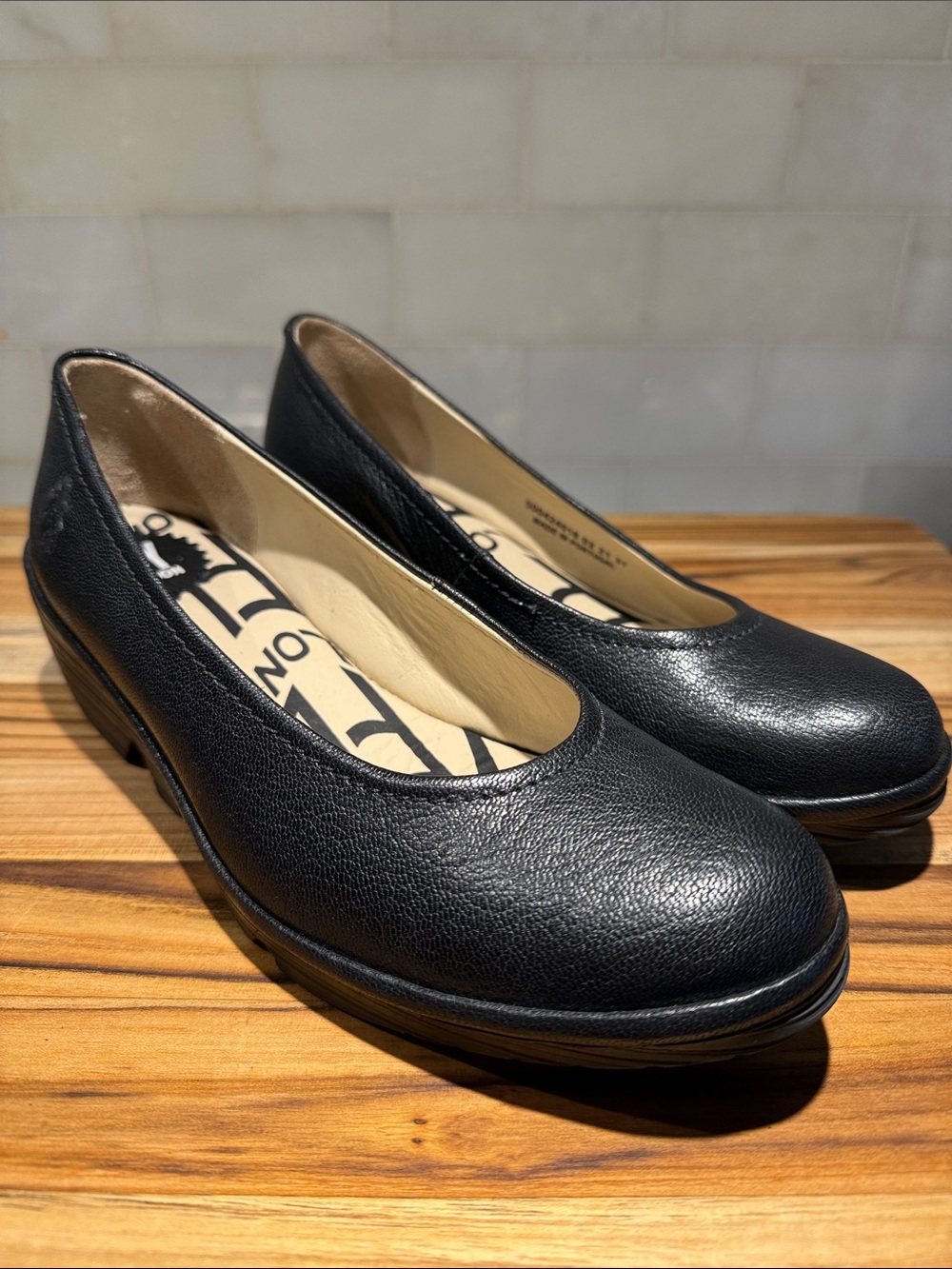 Fly London Black Pebbled Leather Rounded-Toe Flats